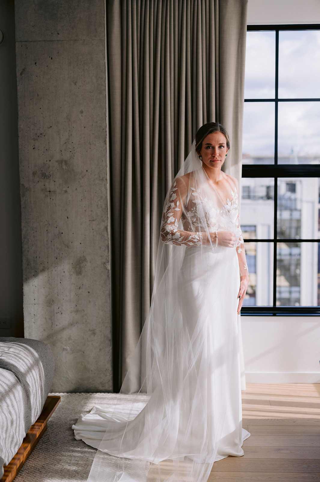 Stunning bride looks enchantingly at the camera in her wedding dress, captured by Mary Shelton Media